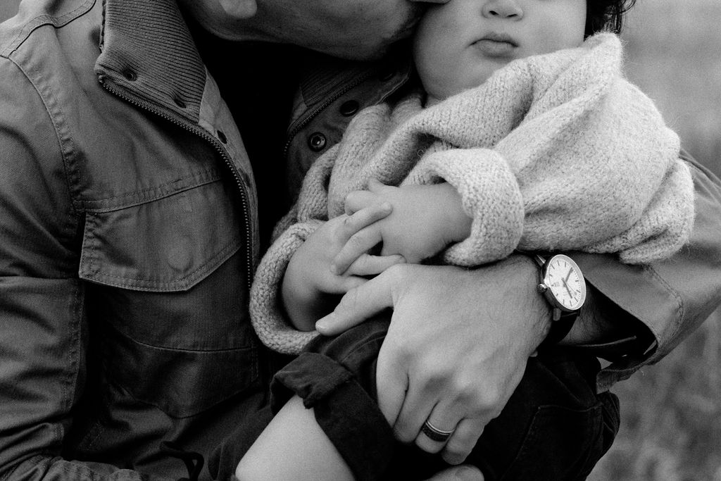 A black and white close up photo with dad and newly 1 year old, in a family photo session with Sophie Grace Photography