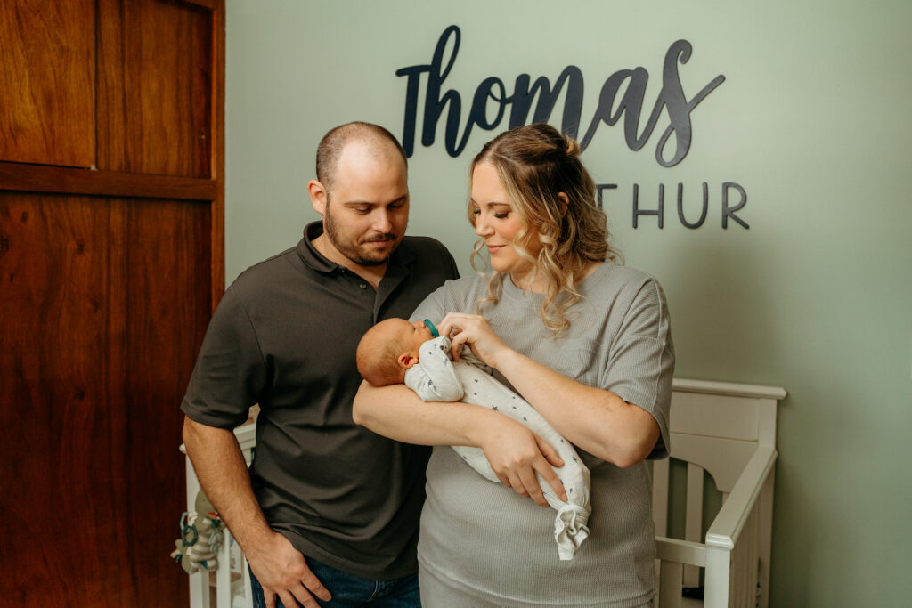 New Parents welcoming their little one during a newborn session with Spokane newborn photographer Sophie Grace Photography