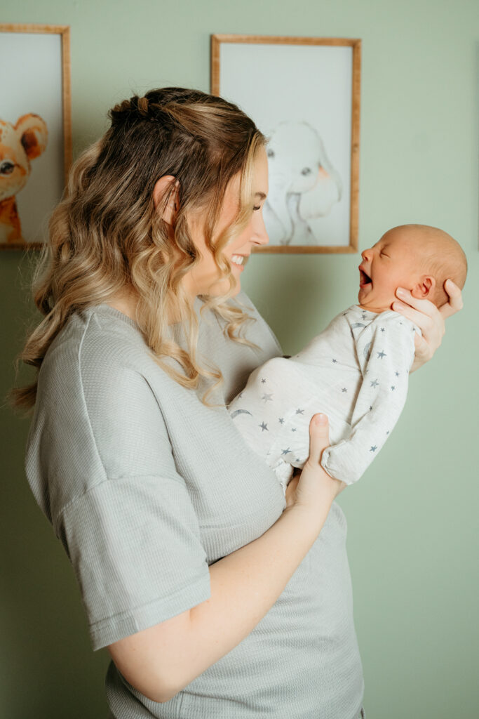 New Parents welcoming their little one during a newborn session with Spokane newborn photographer Sophie Grace Photography