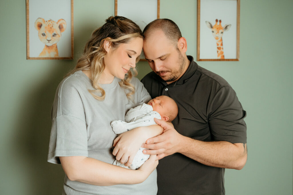 New Parents welcoming their little one during a newborn session with Spokane newborn photographer Sophie Grace Photography