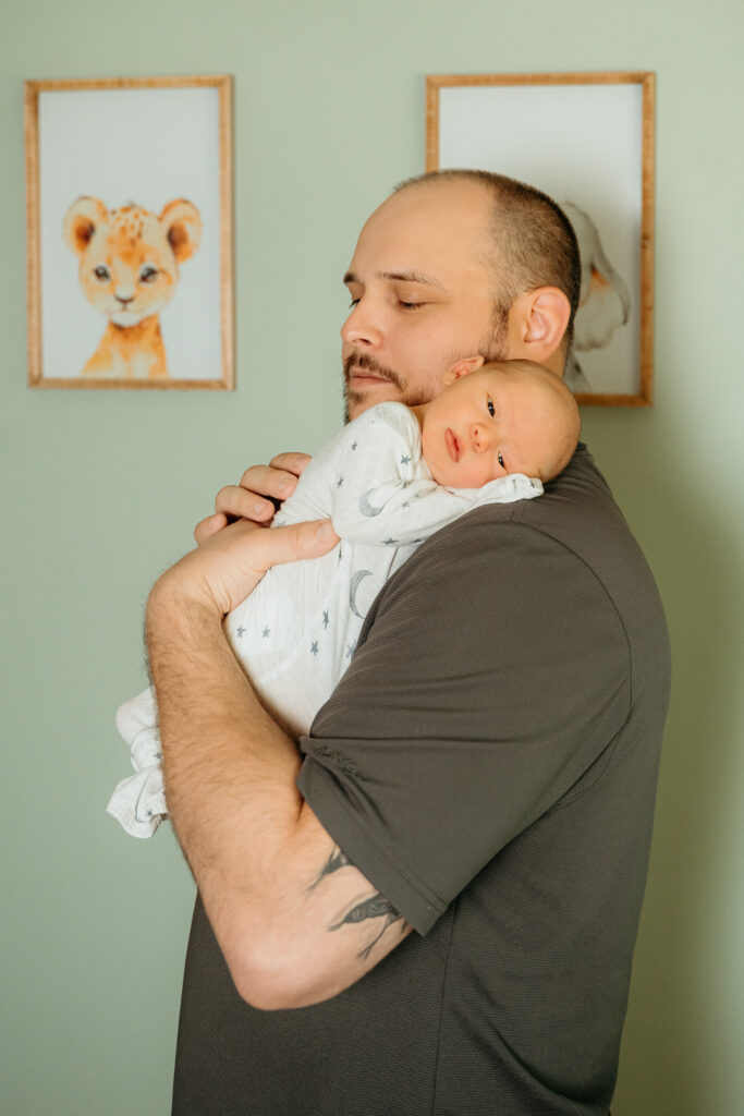 New Parents welcoming their little one during a newborn session with Spokane newborn photographer Sophie Grace Photography