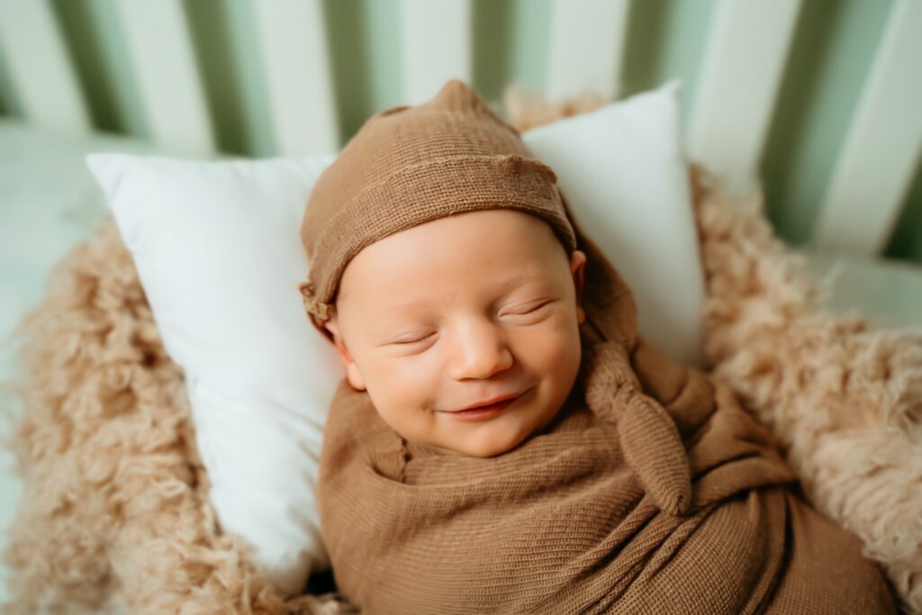 New Parents welcoming their little one during a newborn session with Spokane newborn photographer Sophie Grace Photography
