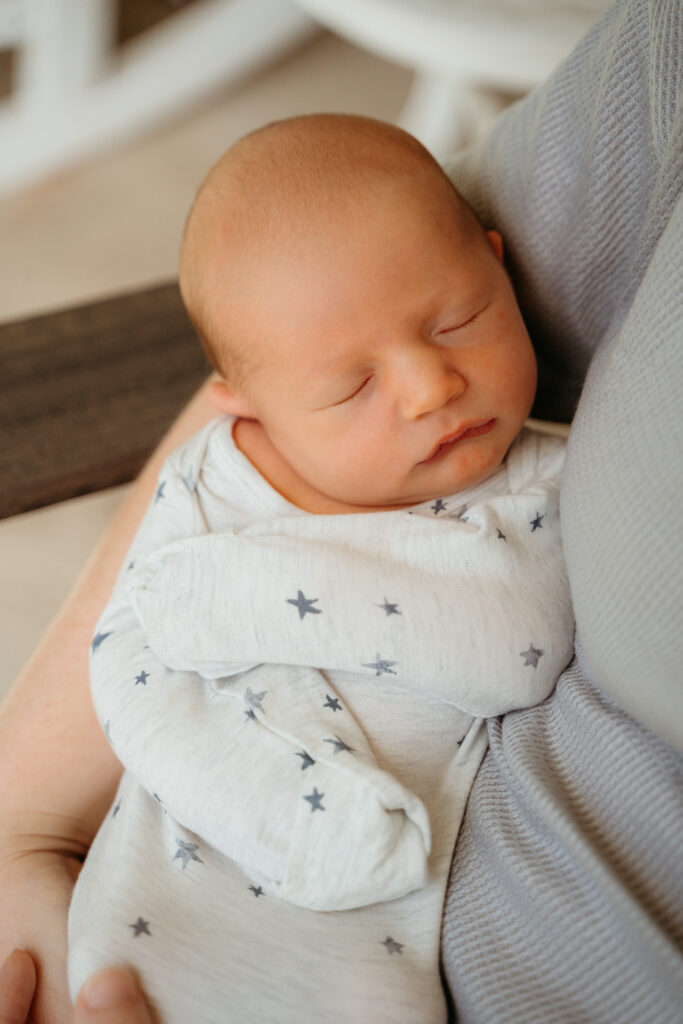New Parents welcoming their little one during a newborn session with Spokane newborn photographer Sophie Grace Photography