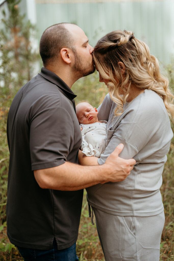 New Parents welcoming their little one during a newborn session with Spokane newborn photographer Sophie Grace Photography