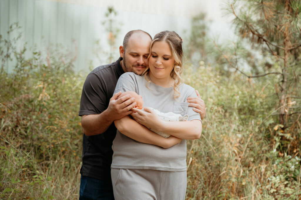 New Parents welcoming their little one during a newborn session with Spokane newborn photographer Sophie Grace Photography