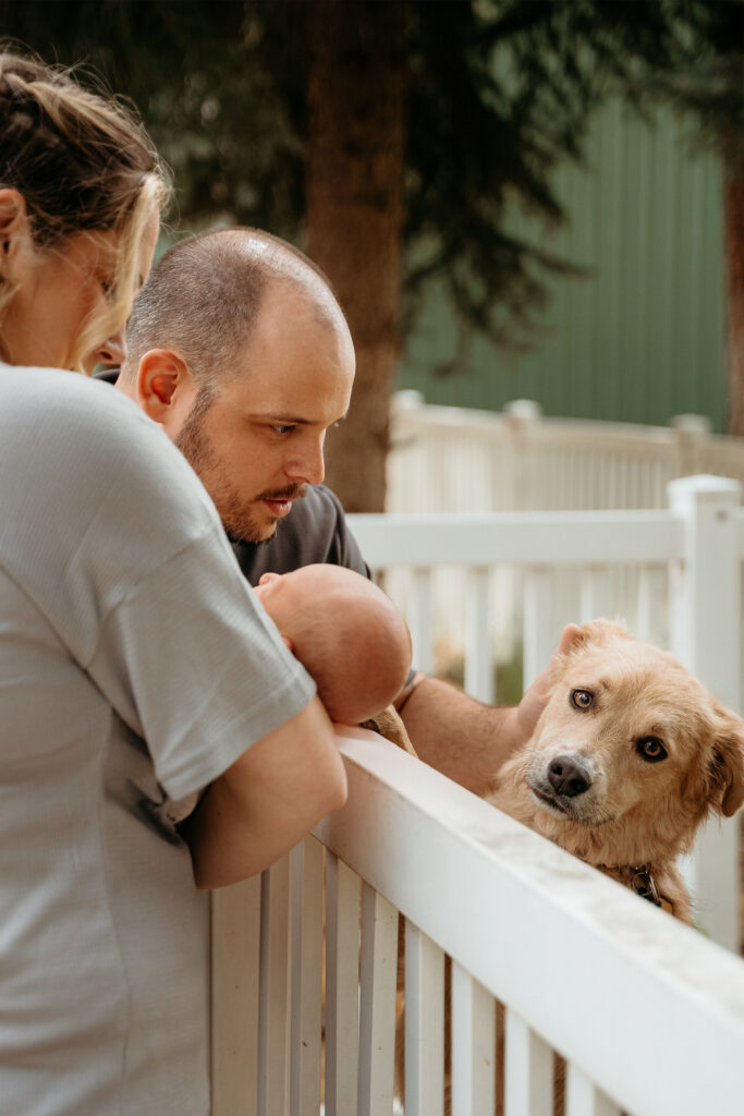 New Parents welcoming their little one during a newborn session with Spokane newborn photographer Sophie Grace Photography