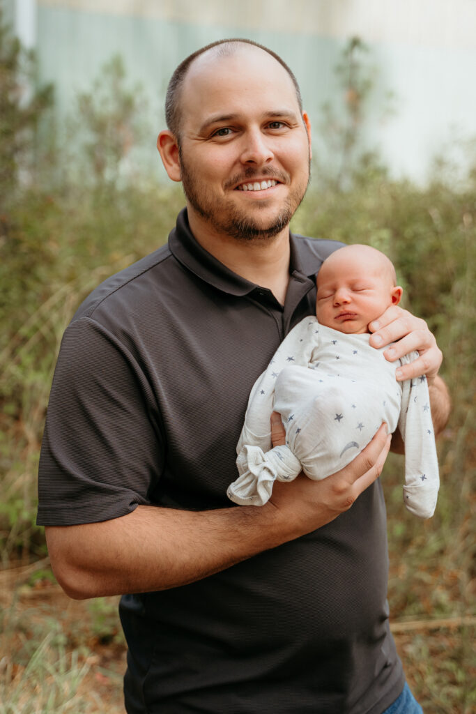 New Parents welcoming their little one during a newborn session with Spokane newborn photographer Sophie Grace Photography
