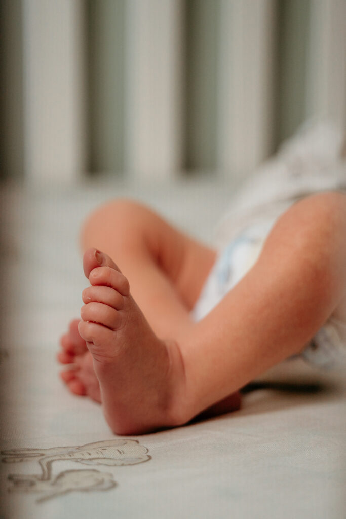 New Parents welcoming their little one during a newborn session with Spokane newborn photographer Sophie Grace Photography
