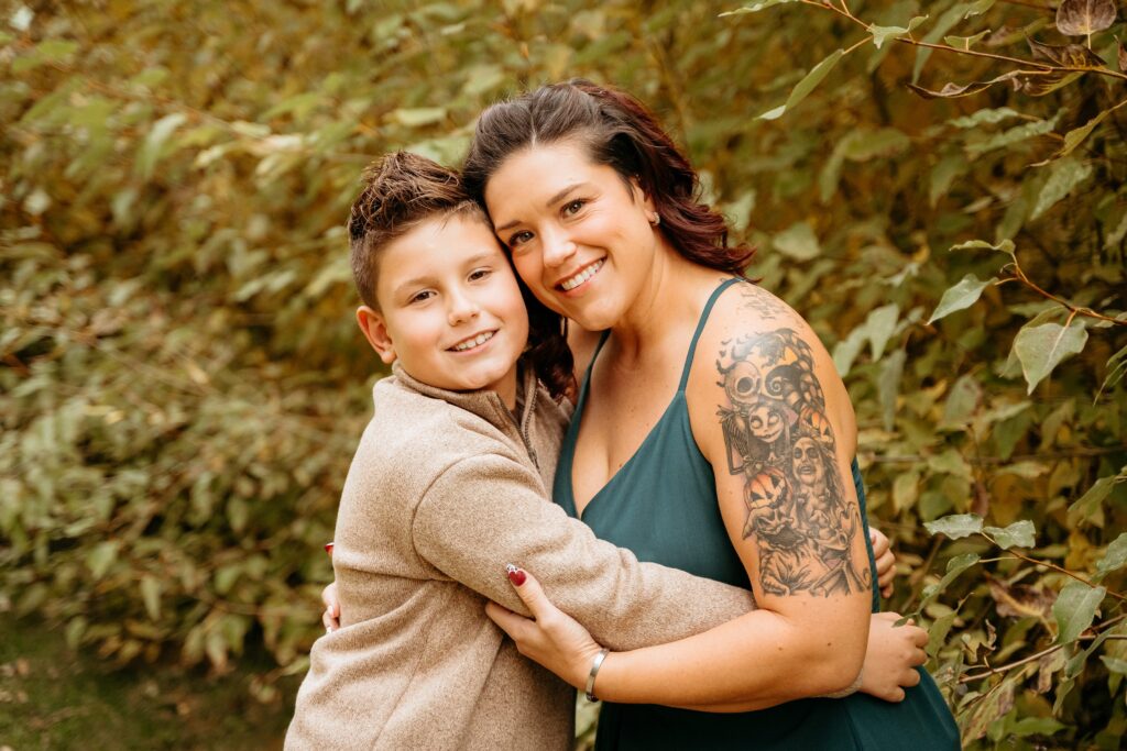 Family laughing together during fall photos in Spokane