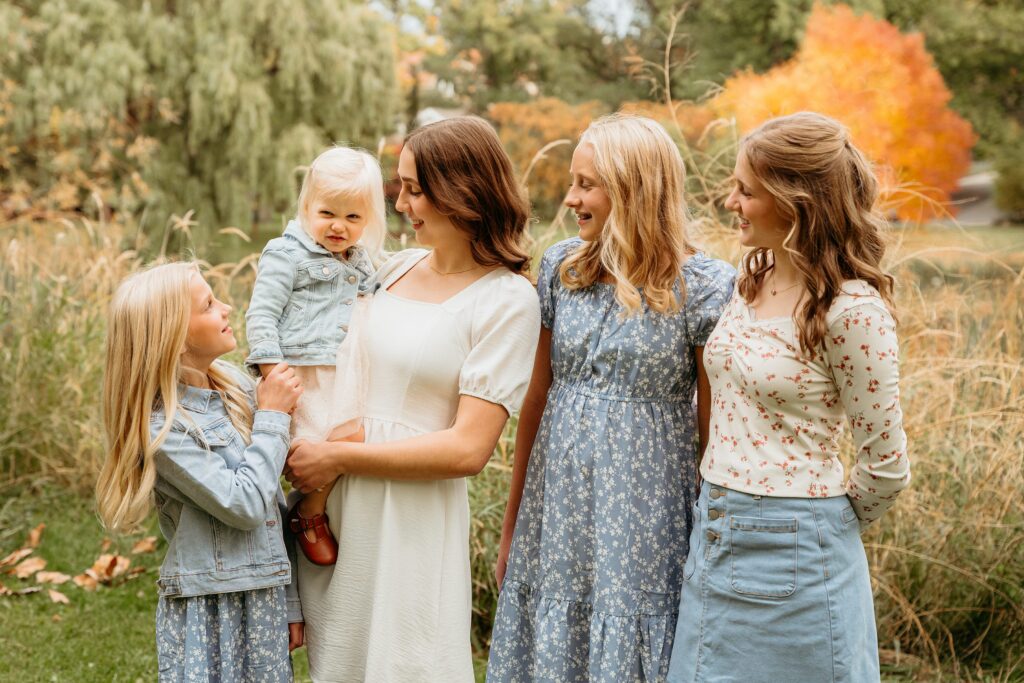 Family laughing together during fall photos in Spokane