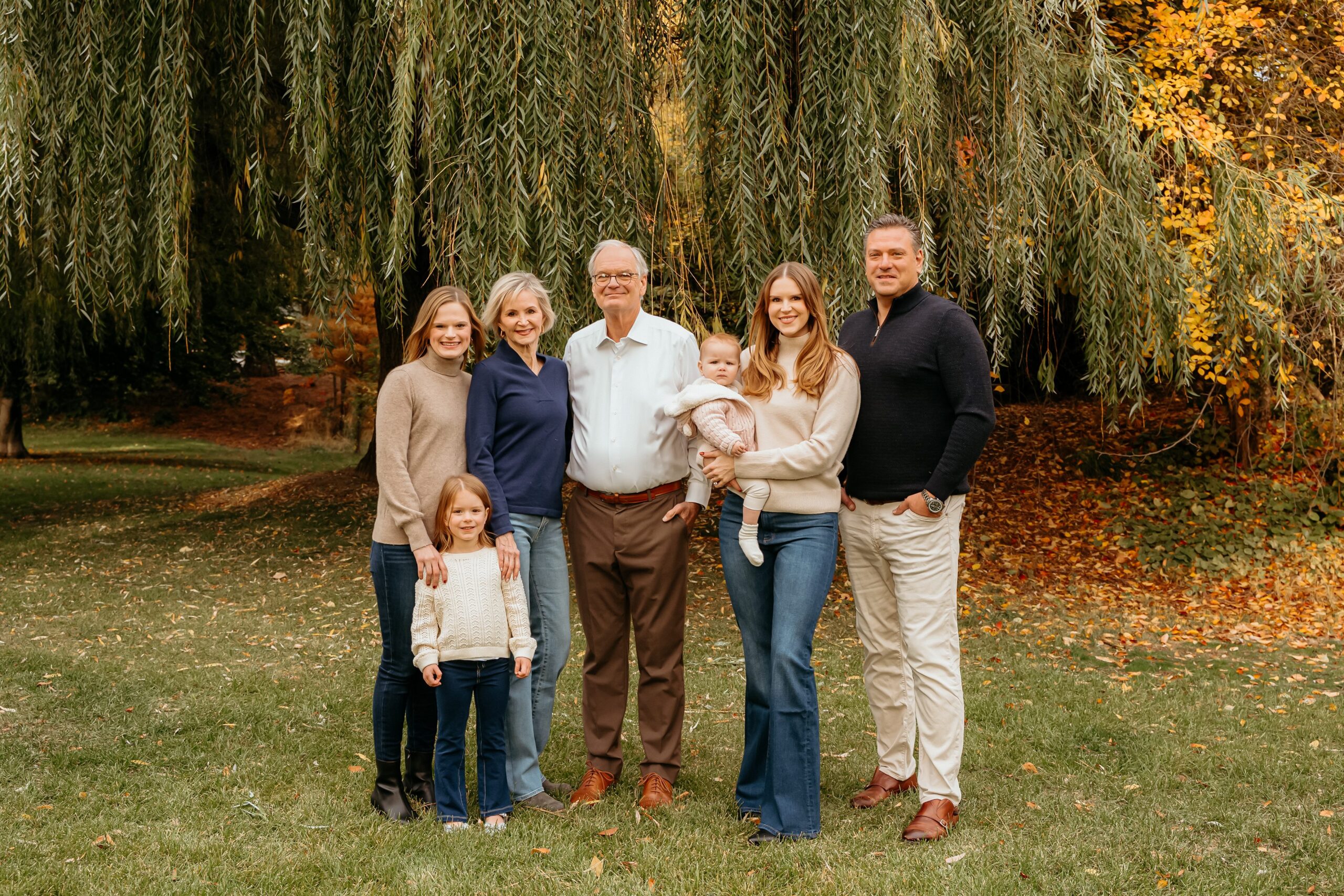 Spokane fall family photography among colorful autumn trees